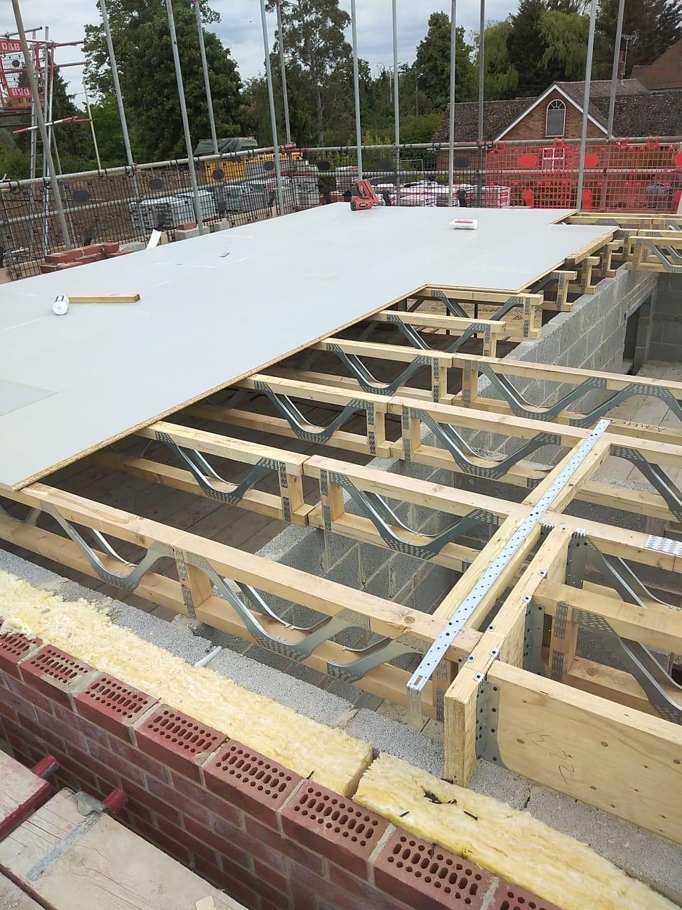 Structural P5 floor deck being laid over Posi-joists at the St Albans new-build apartment site