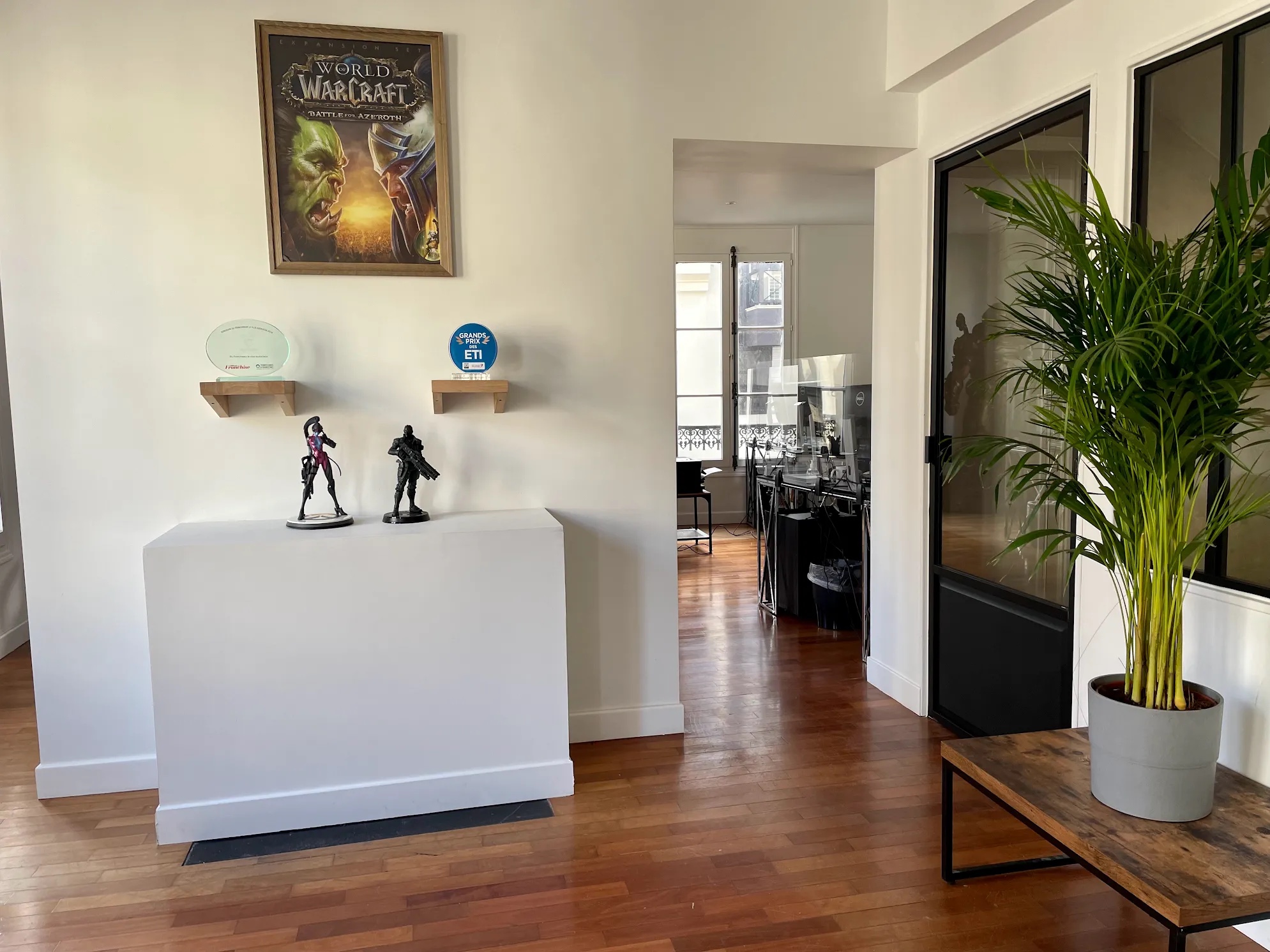 Renovated office with new paint, flooring, and glass partitions for soundproofing and privacy